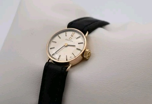 Omega 9ct yellow gold - yellow, round
