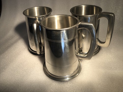 Pewter pint tankards - 3,