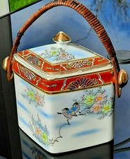 Ceramic Biscuit Barrel. Blue & white with birds, flowers and red border.