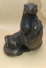 Bronze Effect Sculpture Figurine Featuring A Pair Of Otters In An Embrace