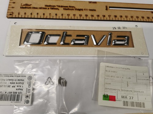 Rear tailgate emblem genuine - rear,