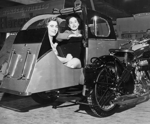 Two women sit - , comfortably