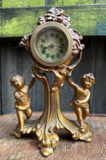 Antique Edwardian bronze cherubs mantel clock by New Haven art nouveau gilt gold