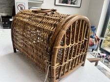A vintage / antique woven wicker cat basket / animal carrier Prop Display