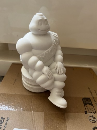 Michelin man sitting tyres - man, on