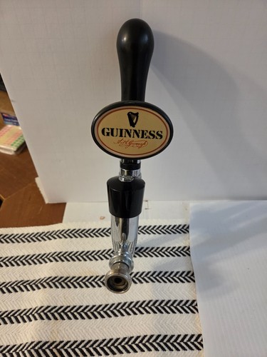 Guinness beer tap handle with - beer,