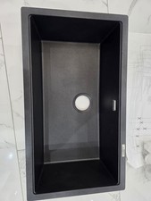 Black quartz kitchen sink.