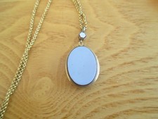 ANTIQUE GILT  LOCKET AND CHAIN