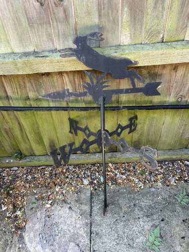 Black metal roof - weather, vane