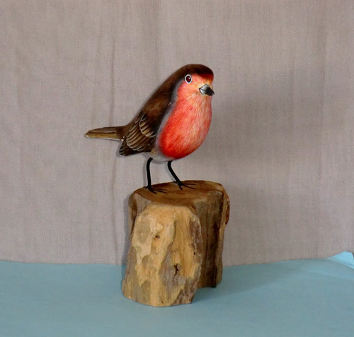 Hand carved wooden robin - hand,
