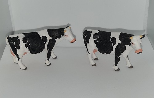 Two siku friesian cow figures - cow,