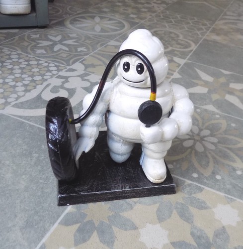 Michelin man inflating a - michelin, "