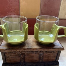 2 Vintage JAJ Pyrex glass cups with green holders
