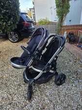 I Candy Peach Double Buggy and Bassinet With Buggy Board And Rain Coat.