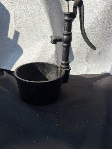Vintage cast iron hand well - cast,