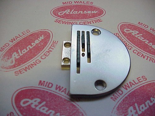 Needle plate rubber feed - &, dog