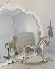 Antique silver rocking horse