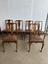 A set of six Queen Anne style dining chairs