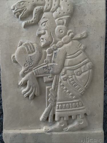 Ulises carved into soft stone - into,
