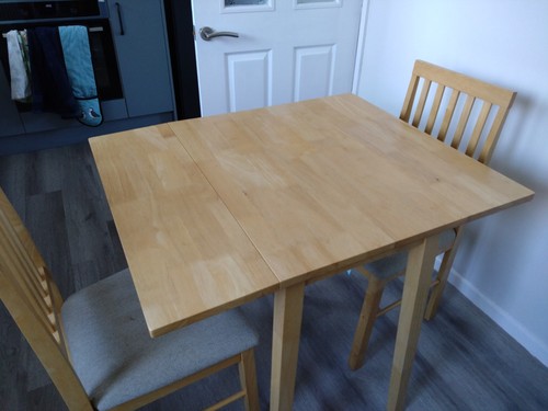 Dining table with two - , chairs