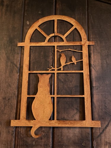 Rusty metal cat window - in,