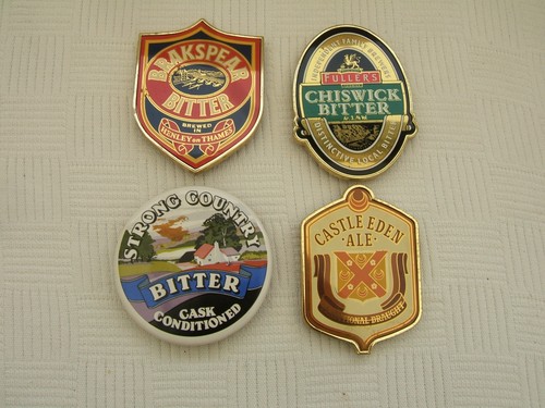 Four beer pump signs for - four, signs.