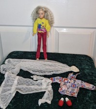 Vintage Hasbro Sindy doll from 1987 with crimped hair and extra clothes