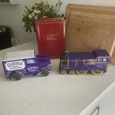 Three Cadburys Tins. One Train, One Van, One ‘Book’, A Novel For Choc Biscuits!