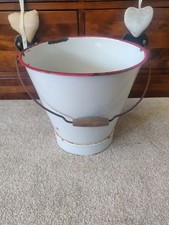Vintage enamel bucket with red