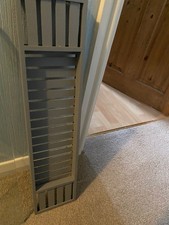 grey wooden bath rack for