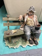CAPODIMONTE PORCELAIN FIGURE, OLD MAN FEEDING BIRDS ON BENCH DAMAGED