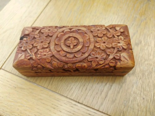 Wooden hand carved box with - hand,