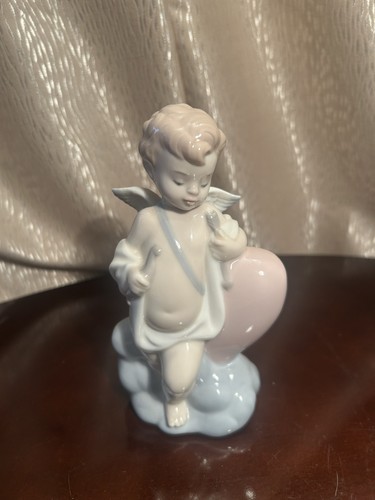 Nao lladro porcelain cupid - by,