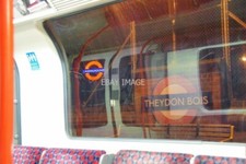 PHOTO  THEYDON BOIS UNDERGROUND STATION SIGN VIEWED FROM INSIDE CARRIAGE