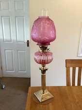 A Cranberry Duplex Oil Lamp.