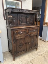 mid 20th century oak court cupboard sideboard with carved pillars and panels.