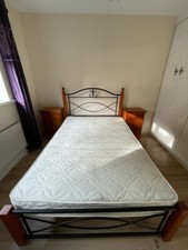 double bed frame, black textured metal frame with wooden corners, 