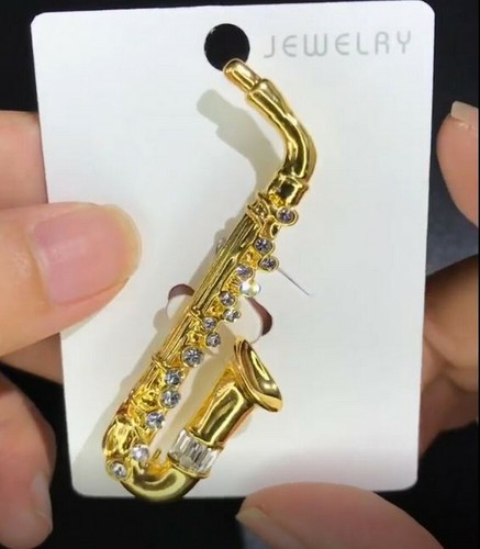 Gold steel saxophone - gold,