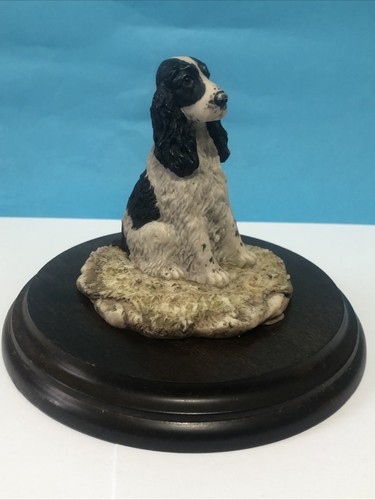 Black white spaniel on base - white,