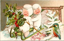 Embossed Christmas Postcard Snow babies Sledding
