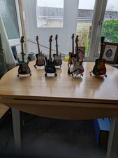 Set Of Seven Mini Guitars With