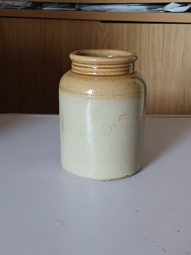 Old stoneware jar - with, honey