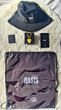 Oasis Wembley 2025 VIP Goodie Bag – Gold Guitar Pick, Hat, Badge, Power Bank Set