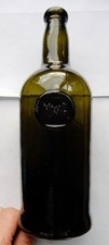 Odd MWA sealed wine bottle (empty) with sagged base c1900-20 (J)