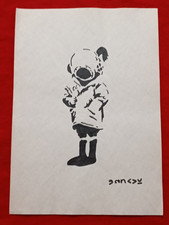 Banksy painting and drawing on