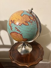 LARGE WORLD GLOBE ON CHROME STAND WRITING IN LATIN.