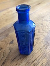 Vintage Small 6 Sided Blue Ribbed Poison Bottle Embossed With "Not To Be Taken"
