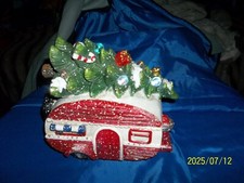 Lighted christmas tree camper
