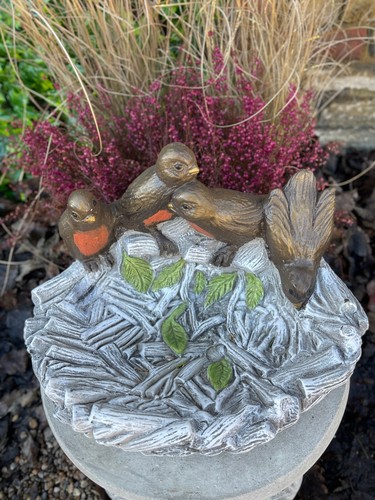 Concrete bird with pot statue