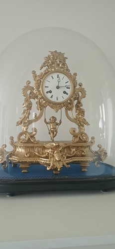 Swinging cherub clock with - swinging,